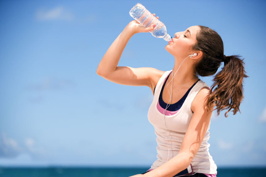 girl drinking bottled water